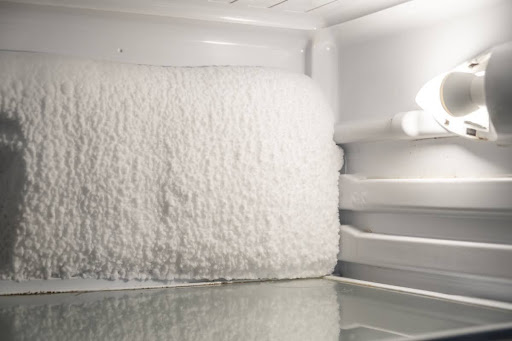 A freezer with ice buildup.