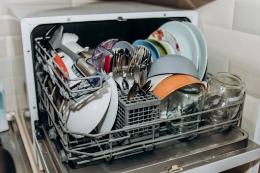 Dishwasher loaded with dishes.