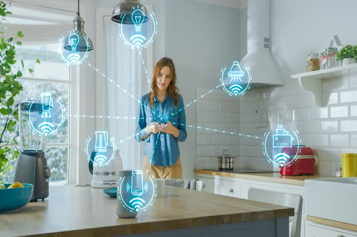 Homeowner checking status of smart appliances on her phone.
